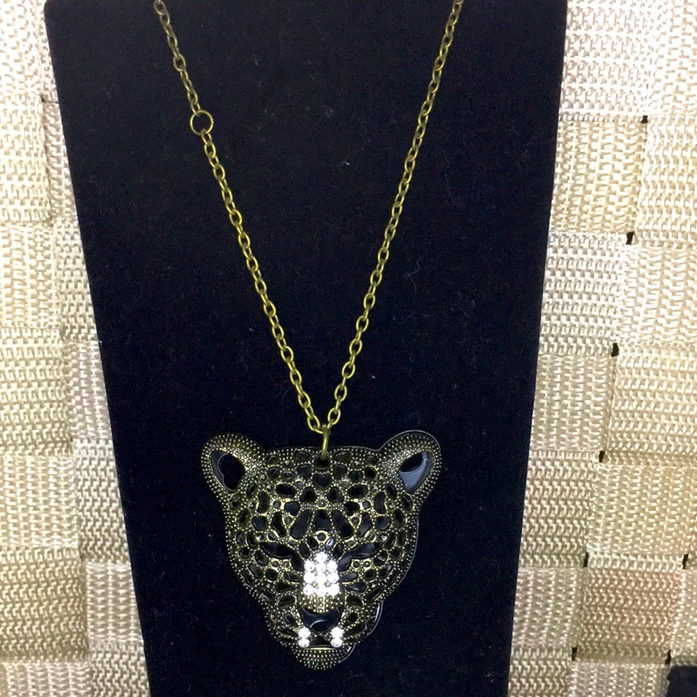 Leopard head necklace.